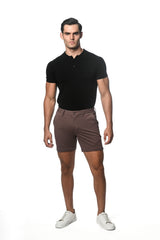 A pair of slim-fit brown textured stretch knit chino shorts with button closure and belt loops