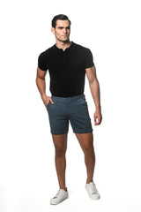 A pair of dark teal textured stretch knit chino shorts with classic fit and belt loops for casual wear