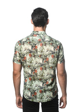 A man wearing a lightweight linen tencel short-sleeved shirt with vibrant floral and bird pattern on off-white background