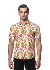 A man wearing a lightweight cotton tencel short-sleeved shirt with vibrant orange yellow pink and white floral pattern