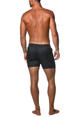 Back view of black jacquard stretch swim shorts with textured ribbed fabric and subtle logo on mesh-lined back pocket
