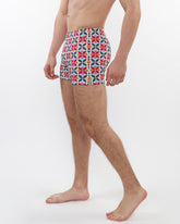 Seersucker swim shorts with mesh lining featuring colorful red blue and white geometric patterns