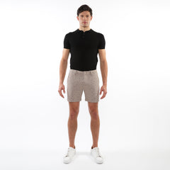 Beige textured jacquard stretch chino shorts with subtle black dot pattern button fly and belt loops