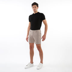 Beige textured jacquard stretch chino shorts with a subtle dark dot pattern made from lightweight fabric