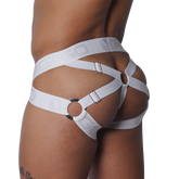 White elastic jockstrap featuring a strappy cage design with metal rings, adjustable buckles, and logo-embossed bands.