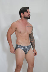 Black and white patterned briefs with repeating geometric design from the fancy symbols swim brief collection