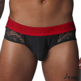 Black jock thong with floral lace side panels and a wide red elastic waistband featuring the Gigo logo.