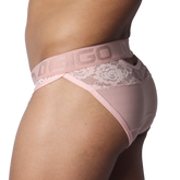 Romantic pink brief featuring a branded elastic waistband, floral lace accents, and sheer, ribbed fabric.