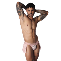 Romantic pink Gigo skirt featuring delicate floral lace trim and a branded elastic waistband on a thong-style base.