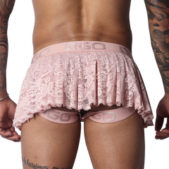 Romantic pink lace skirt featuring a pleated design, scalloped hem, and branded elastic waistband with strap details.