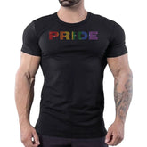 Man wearing a black Rico Starr t-shirt with rainbow rhinestone PRIDE lettering across the chest.