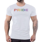 A person wearing a white t-shirt featuring the word PRIDE in rainbow rhinestone lettering.