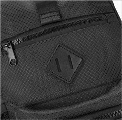 Black sport crossbody sling bag with mesh texture diamond-shaped leather patch and black zipper details