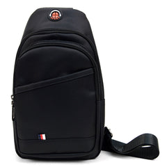 Black nylon crossbody sling bag with red and white circular logo and small flag emblem on front