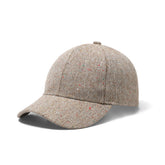 Beige tweed speckled baseball cap with subtle red and green flecks perfect for casual outdoor wear