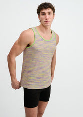 A model wearing a ST33LE grass space dye textured knit tank top with green trim and black shorts.