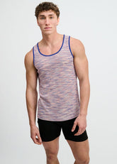 A male model wearing a purple ST33LE space dye textured knit tank top and black shorts.
