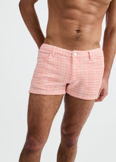 Model wearing pink stretch knit tweed look jacquard shorts by ST33LE.