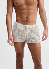 A shirtless man models ST33LE amber and blue tweed-look jacquard shorts with a 3-inch inseam.