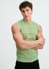 A model wears the ST33LE menthol pointelle open knit vest tank top with arms crossed.