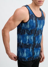 A man wearing a blue and navy abstract print stretch mesh performance tank top.