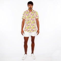 A vibrant fruits print stretch knit shirt with a lemon and lime pattern in yellow green pink and black on light background