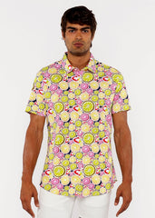 A vibrant short-sleeved fruits print stretch knit shirt with lime and pink citrus slices on a light yellow background