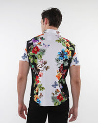 Floral border print stretch knit shirt with vibrant red blue purple and green floral and butterfly design on white base