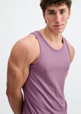 A man wearing a grape-colored ST33LE rib modal tank top against a white background.