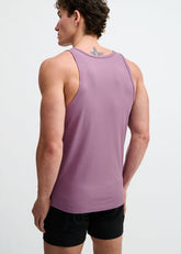 A man from behind wearing a ST33LE ribbed grape tank top and black shorts against a white background.