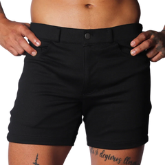 Slim-fit black shorts in a smooth, durable fabric with belt loops, a single button closure, and front pockets.