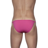 Bright pink form-fitting groovin string bikini swim trunks with a thin elastic waistband in fuchsia pink