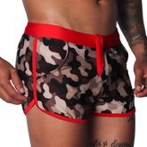 Men's camouflage print swim shorts with red trim, elastic waistband, and matching drawstring.
