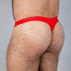 Bright red tulio swim thong made of smooth stretchy fabric perfect for swimwear and beachwear