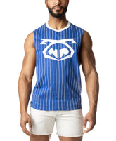 A model wearing a blue and white pinstriped sleeveless shirt with a large logo on the chest and white denim shorts.