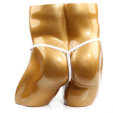 White thong displayed on a glossy gold mannequin torso highlighting the u-station foundation thong white u0024-100