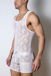 A man models a white lace Timoteo Windsor Singlet Chaps against a plain background.