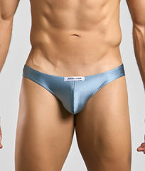 Justin + Simon classic mens bikini light blue satin briefs with sleek form-fitting design and white brand tag at waistband