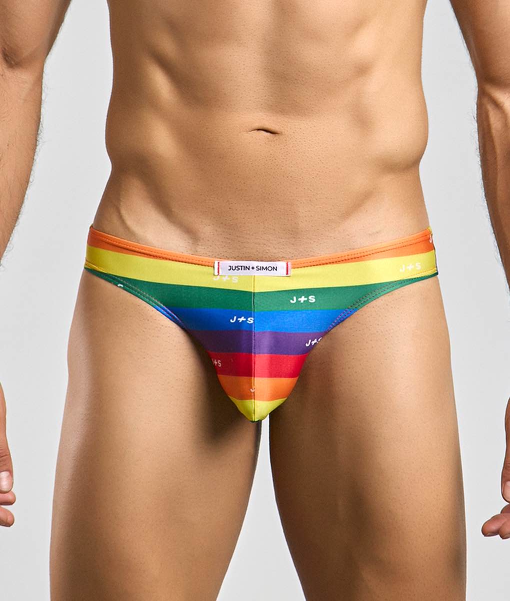Justin + Simon classic mens bikini briefs in rainbow stripes with vibrant orange to purple gradient and repeating j plus s logos