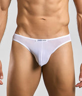 White sheer mesh briefs with a white waistband featuring the justin + simon brand label from classic mens bikini mesh collection