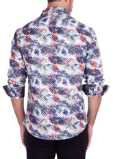 A man wearing an abstract brushstroke long-sleeved shirt with geometric patterns in gray black orange pink and white