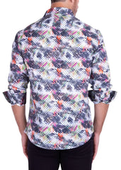 A man wearing an abstract brushstroke long-sleeved shirt with geometric patterns in gray black orange pink and white