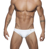 White ad basic swim brief with subtle logo on waistband made of comfortable quick-dry fabric for water activities