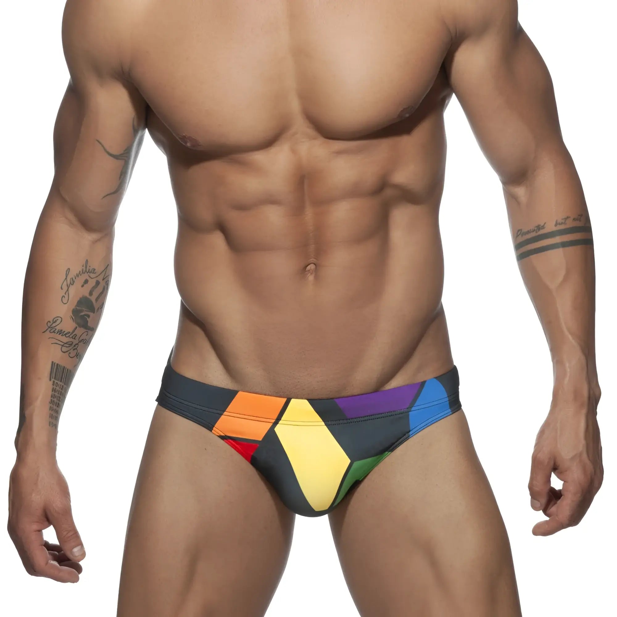 Vibrant geometric-patterned ad pride bikini swim trunks in bold rainbow hues designed for swimming and beachwear