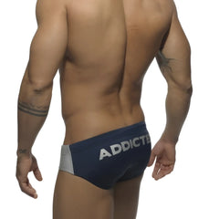 Navy blue and gray athletic briefs with white addicted logo waistband silver logo contrast bikini swimwear size s
