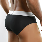 Agacio zotico live classic brief black size s featuring black briefs with white elastic waistband and subtle wing logo