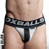Black and white airmesh jockstrap briefs with breathable mesh fabric and bold oxballs logo waistband visible from front