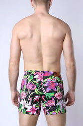 Balboa hybrid swim short vibrant floral-patterned swim trunks in bold pink purple green on black background