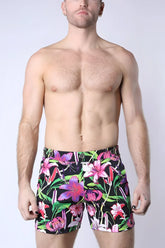 Balboa hybrid swim short with vibrant floral pattern in bold pink purple and green on black fabric for swimwear use