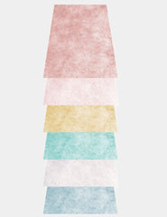 A stack of six pastel colored textured paper sheets for barcode berlin mask filters pack in size one size